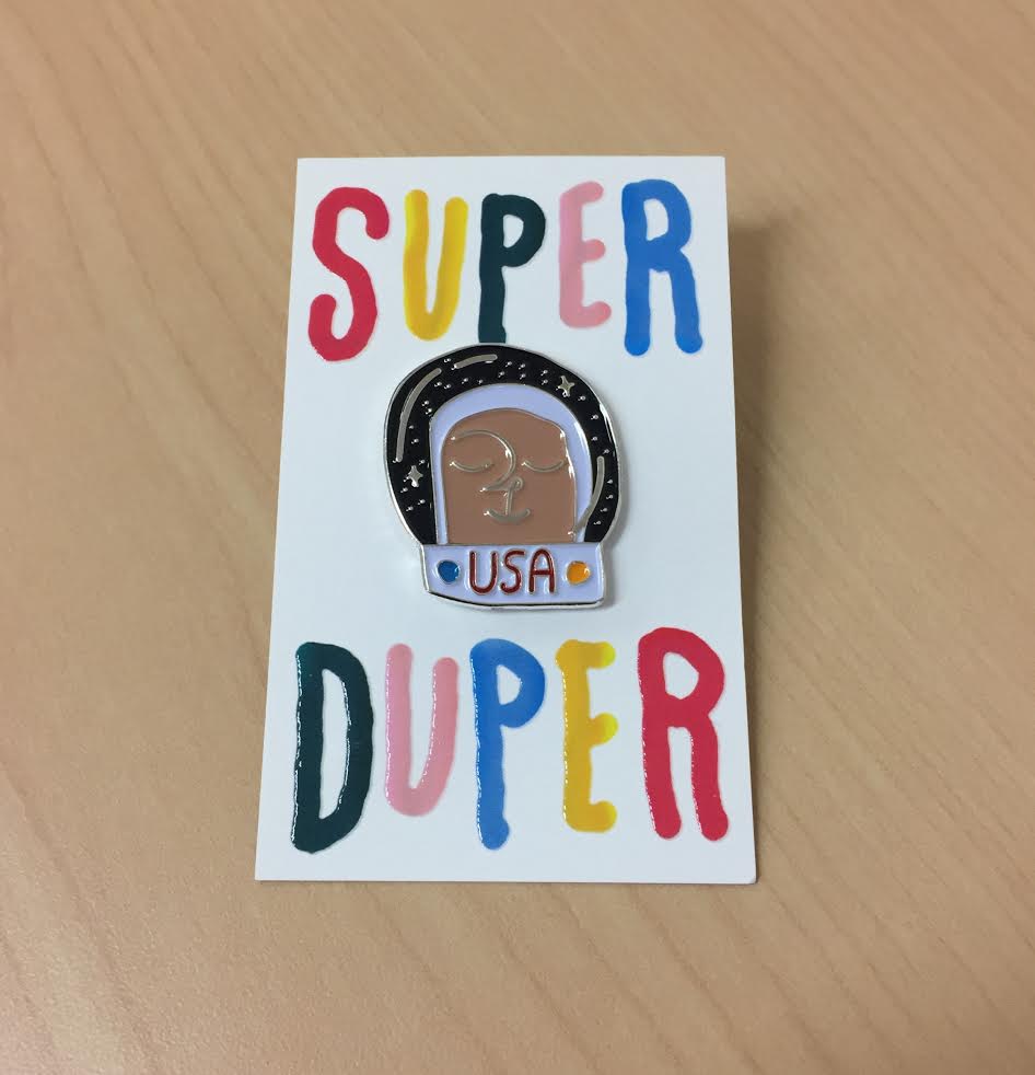 Product shots of Super Duper - Astronaut Enamel Pin