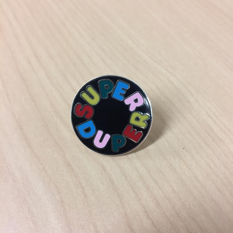 Product shots of Super Duper - Logo Enamel Pin