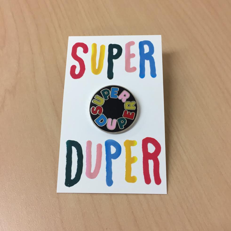 Product shots of Super Duper - Logo Enamel Pin