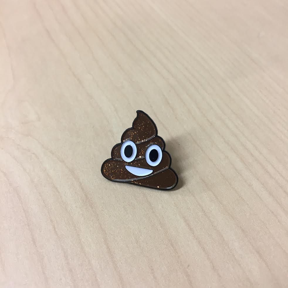 Product shots of Flower Chainz - Glitter Poop Enamel Pin
