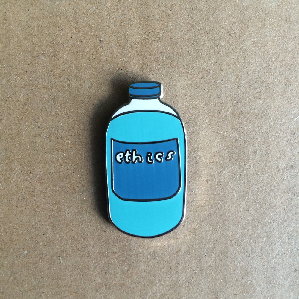 Product shots of Corey Purvis - Ethics Enamel Pin