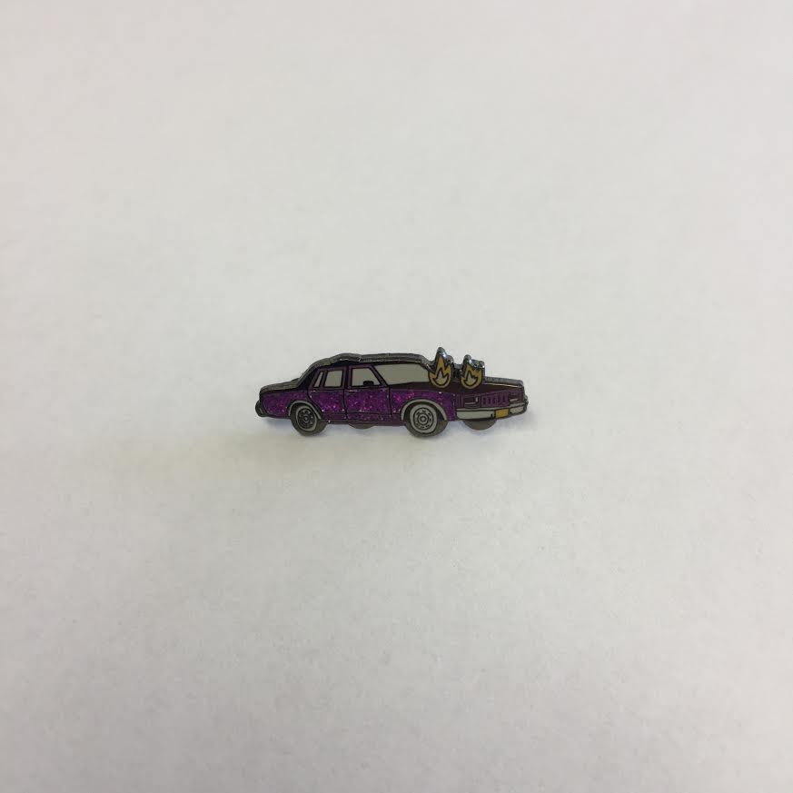 Product shots of Corey Purvis - Burning Car Enamel Pin