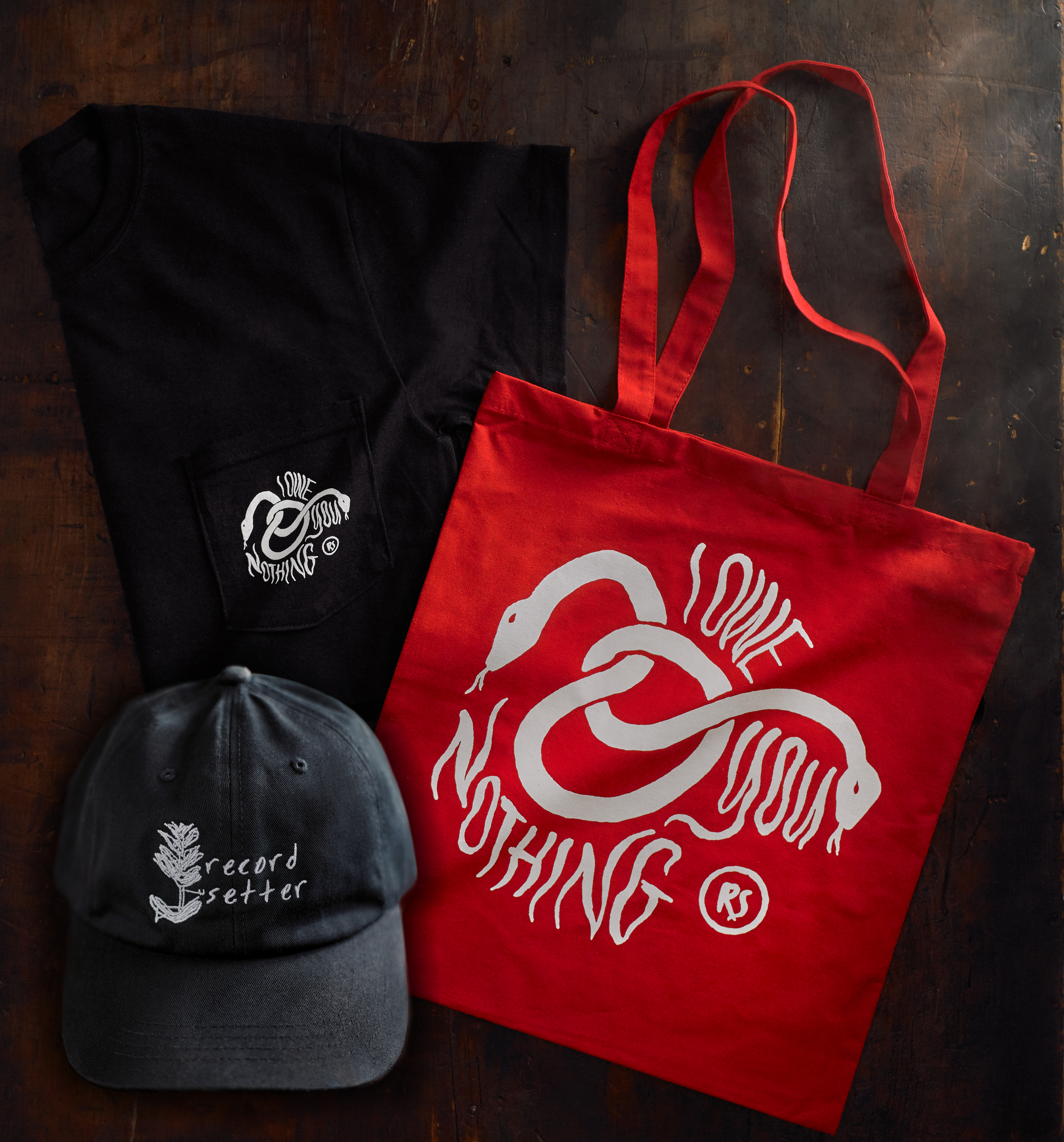 Product shots of Record Setter - IOYN Shirt + Hat + Tote Bundle