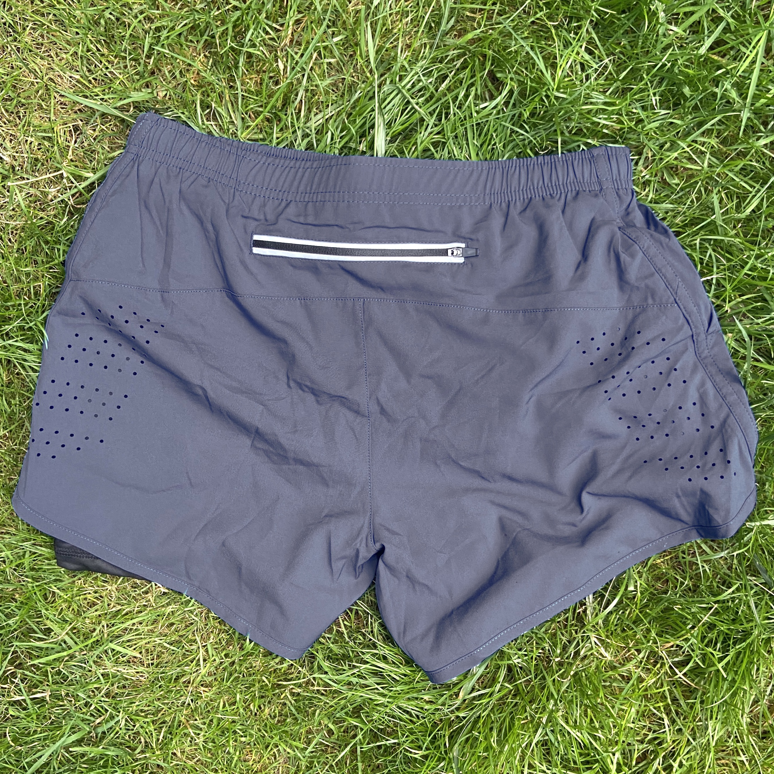 Product shots of Topshelf Records - Running Club Shorts
