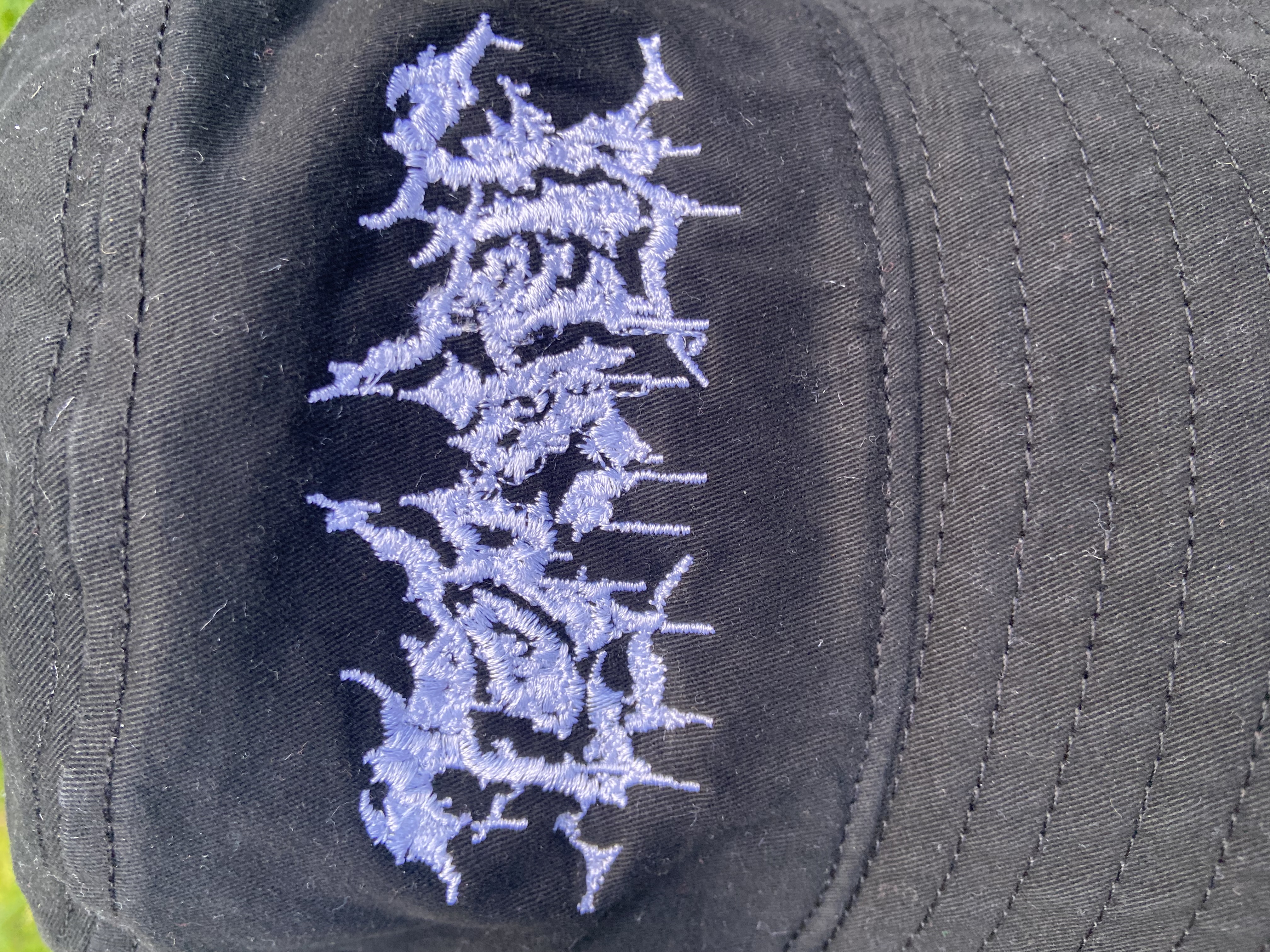 Product shots of Topshelf Records - slam logo bucket hat