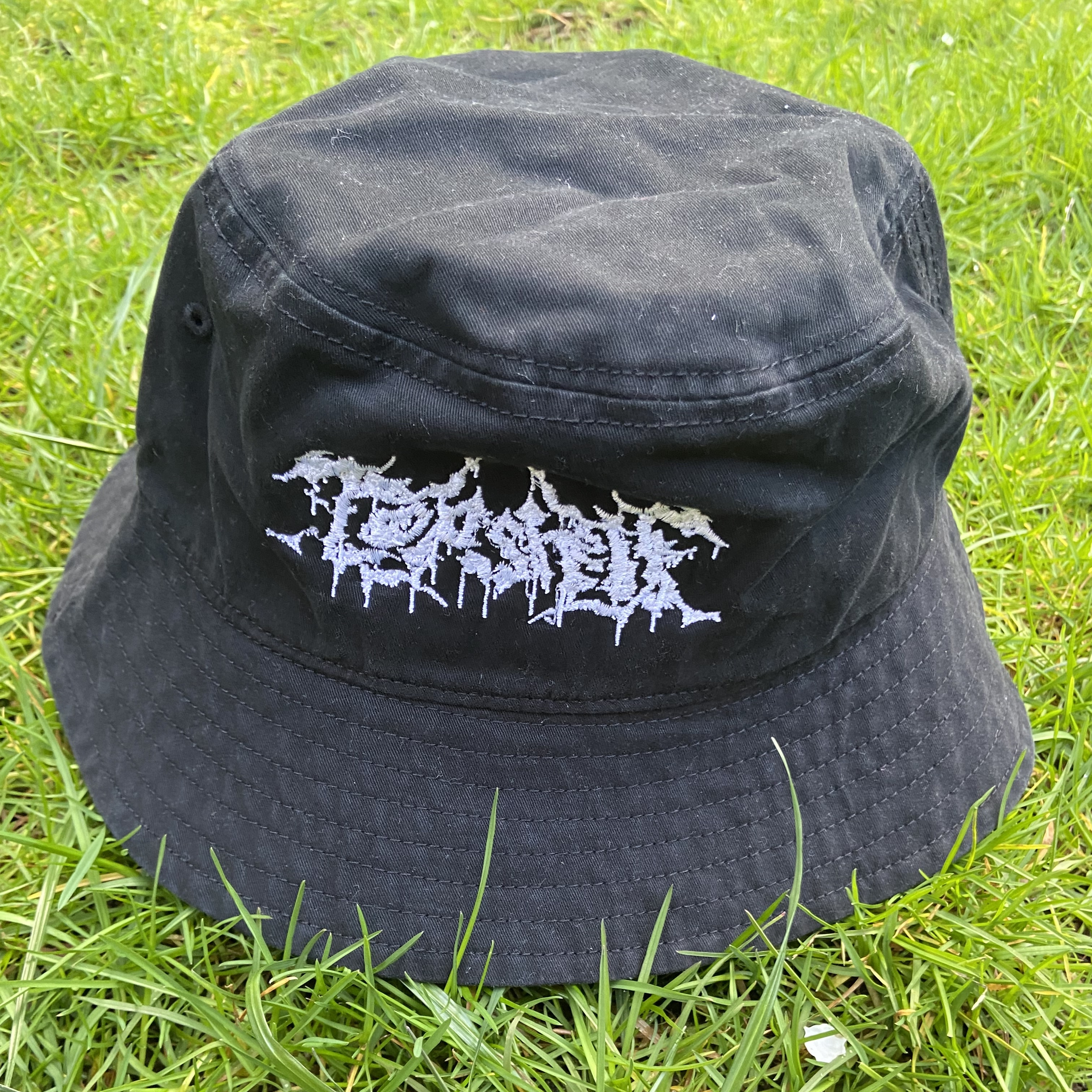 Product shots of Topshelf Records - slam logo bucket hat