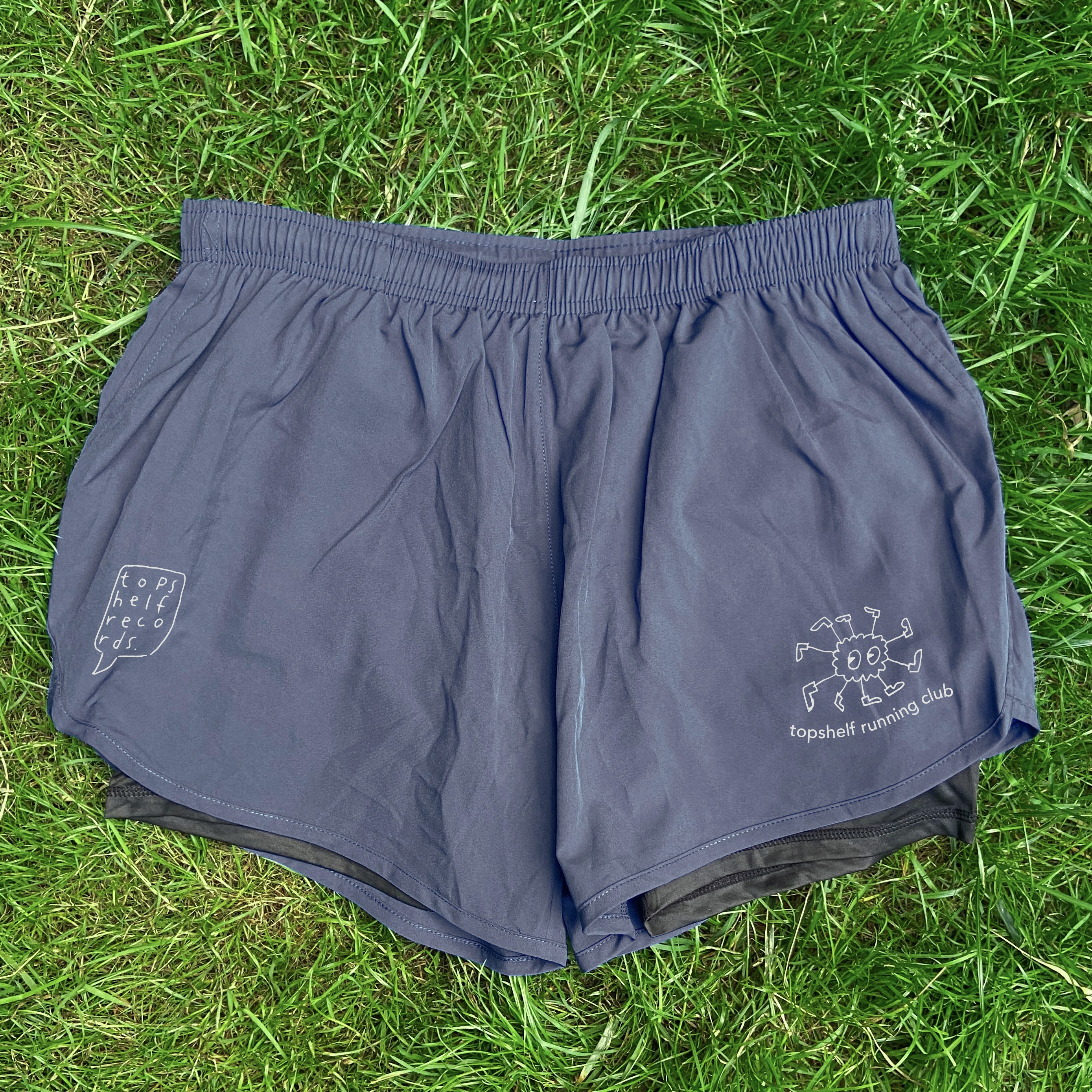 Product shots of Topshelf Records - Running Club Shorts