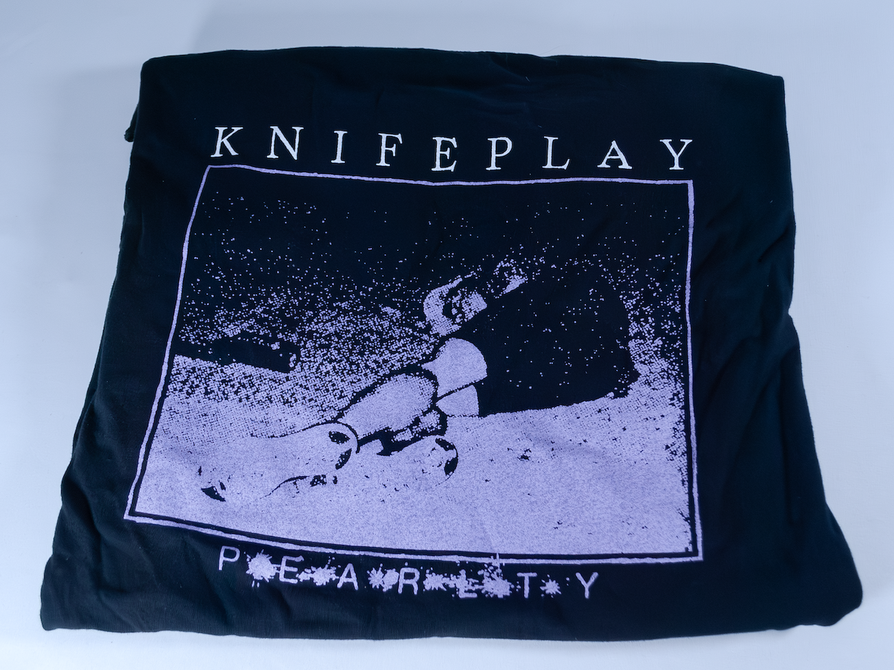 Product shots of Knifeplay - 'Pearlty' T-shirt