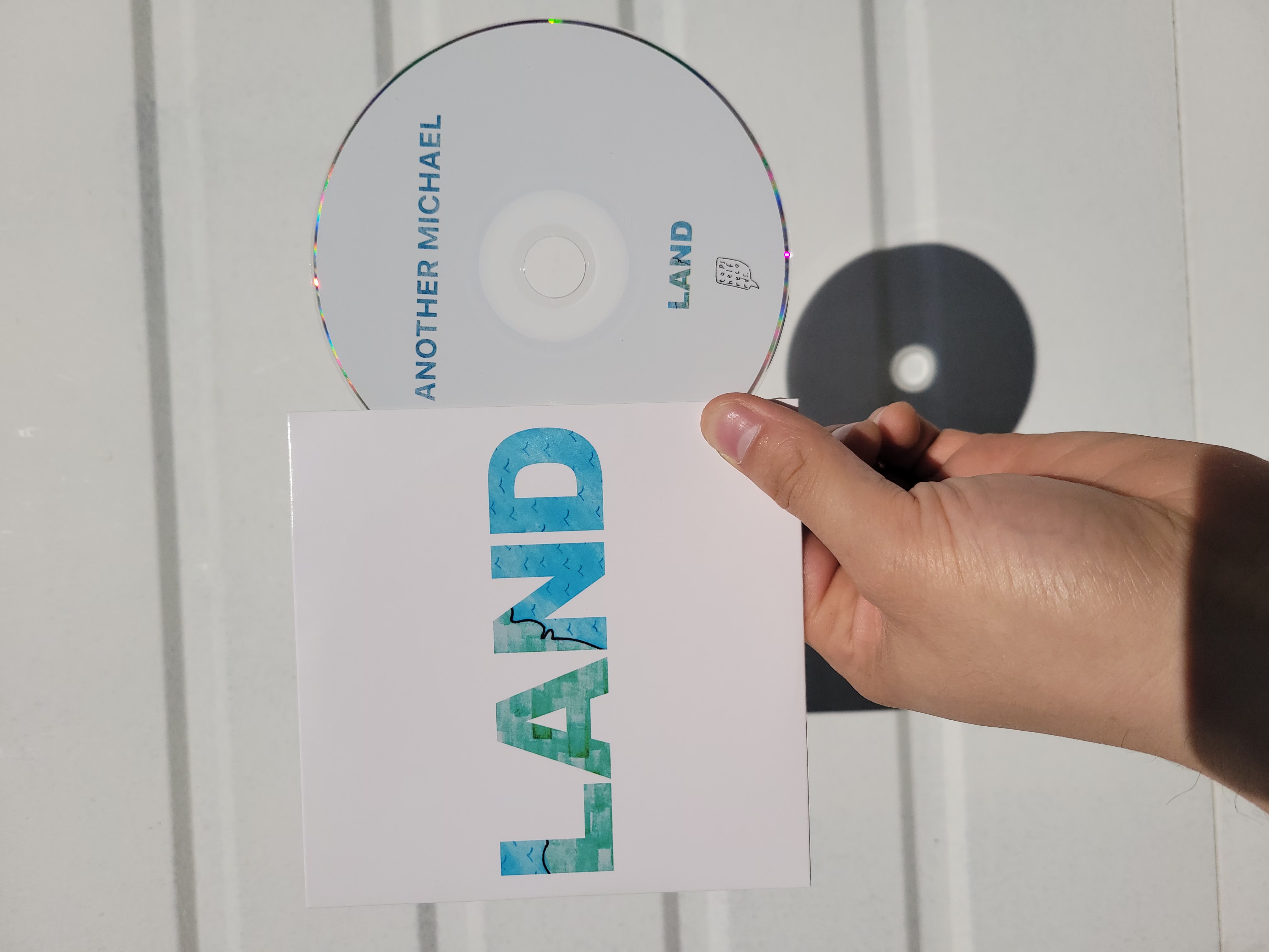 Product shots of Another Michael - Land