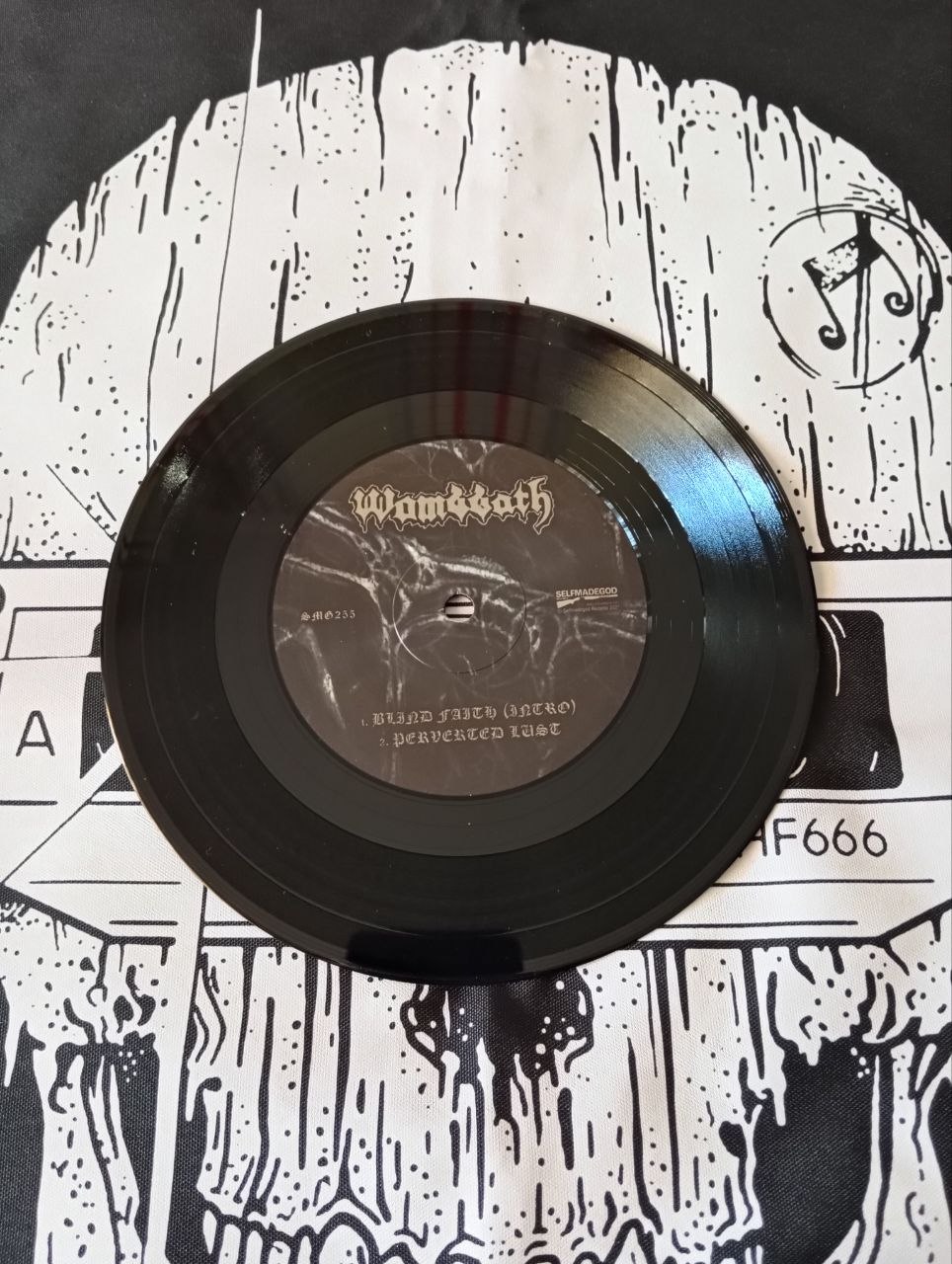 Wombbath / Paganizer - Hymns To Rot (7